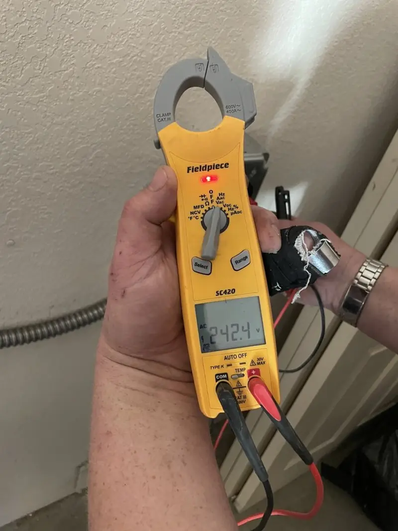 Voltage testing with clamp meter during Recessed Lighting Installation in Whitefish